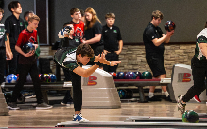 Boy after releasing bowling ball